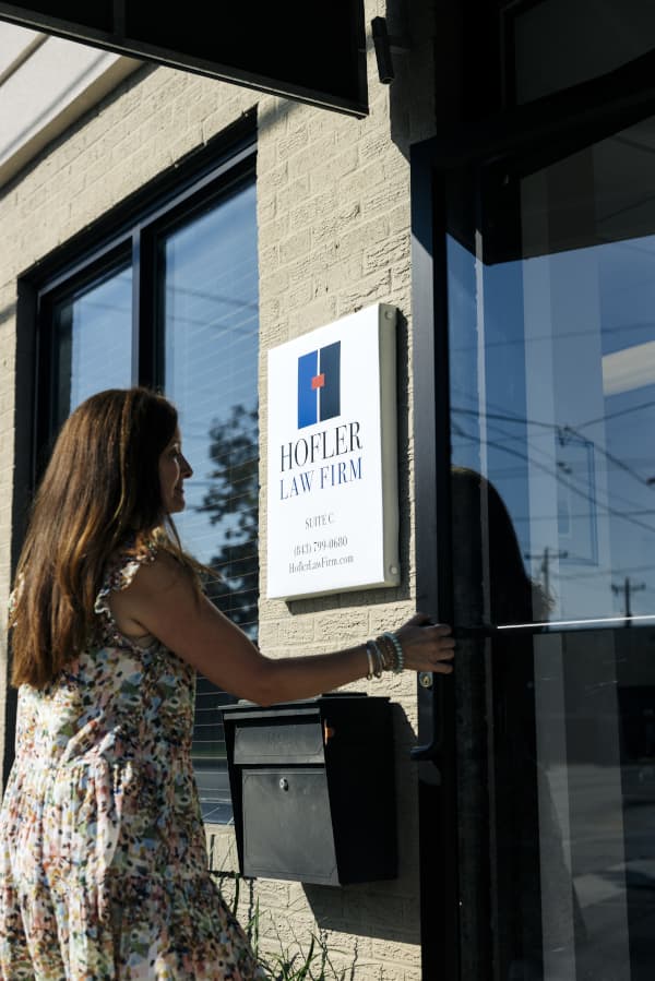 Woman entering hofler Law Firm Florence SC